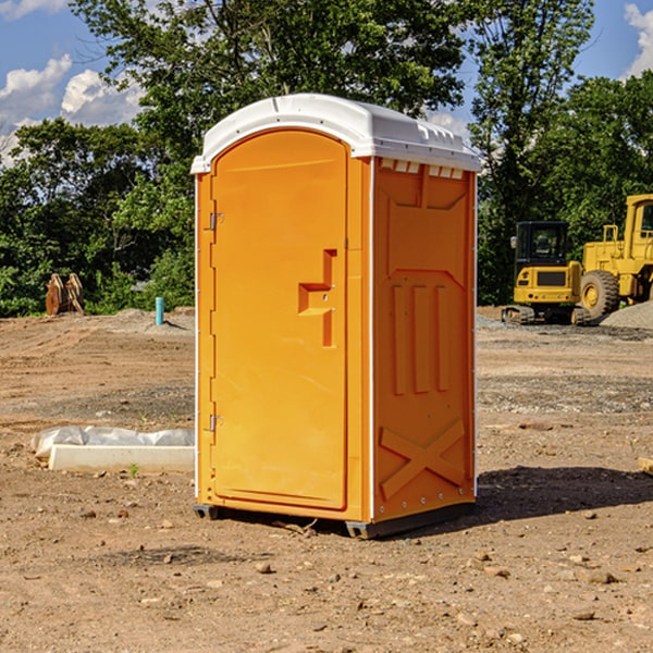 what is the cost difference between standard and deluxe portable restroom rentals in Bandy